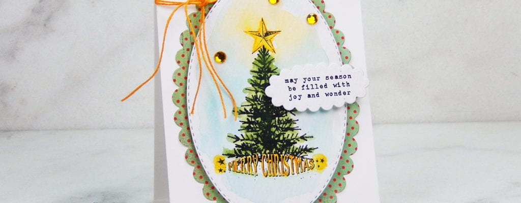 A Christmas card with colored pens and watercolor.